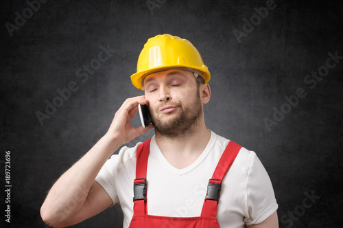 Construction worker using smartphone