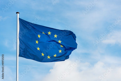 European flag waggling in the wind with blue sky