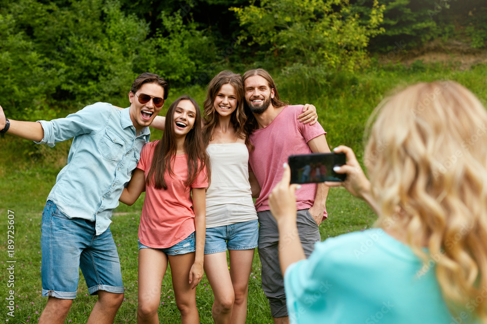 Happy Friends Having Fun On Picnic In Nature