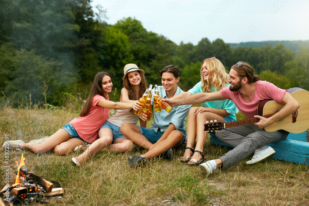 Happy Friends Having Fun On Picnic In Nature Happy Friends Having Fun On Picnic In Nature