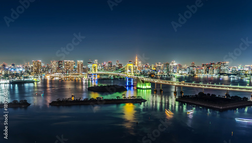 Asia Business concept for real estate   corporate construction - panoramic modern city skyline view  of tokyo tower   rainbow bridge with neon night in Odaiba  Tokyo  Japan.