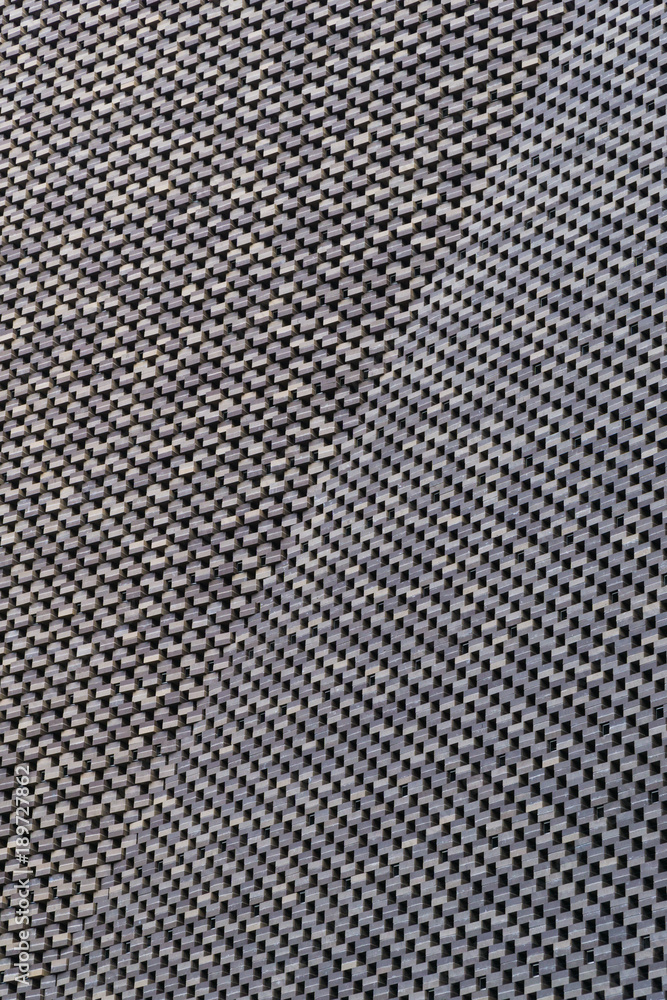 Old grey brick wall pattern with a bend in the architecture. Old grey brick wall pattern with a bend in the architecture.