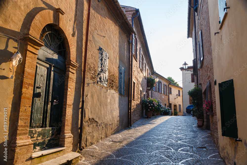 Beautiful narrow streets of the medieval village Fiorenzuola di Focara near to Pesaro, Marche, Italy