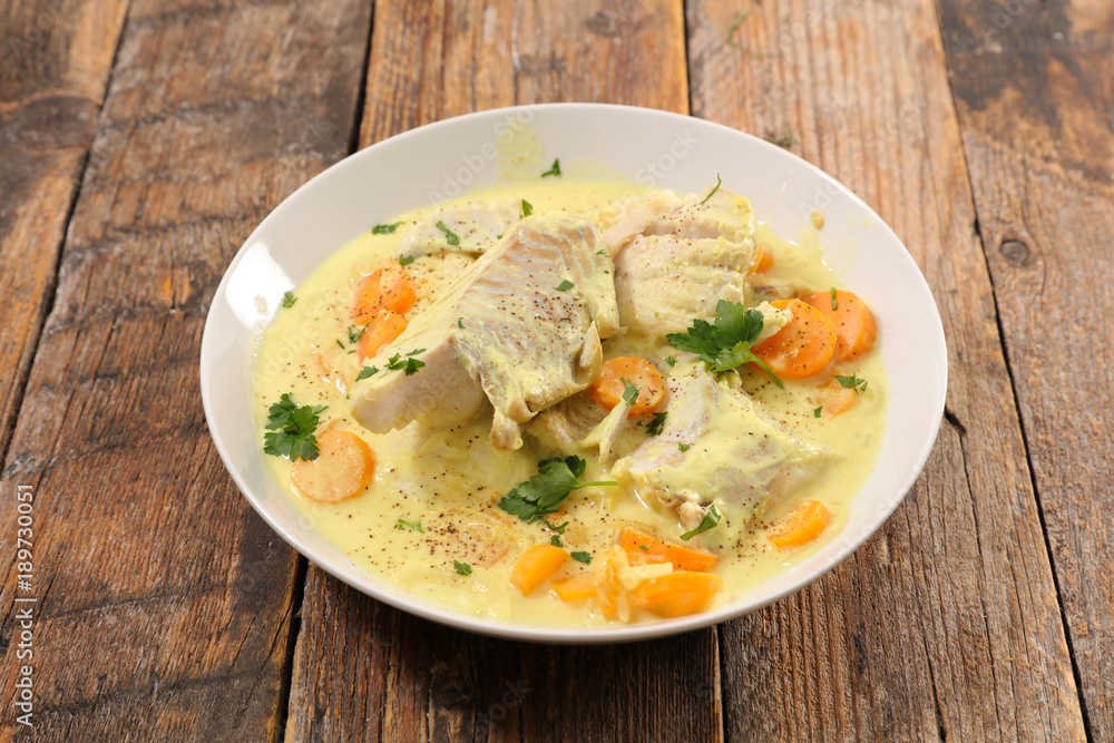 fish cooked with cream, carrot and curcuma