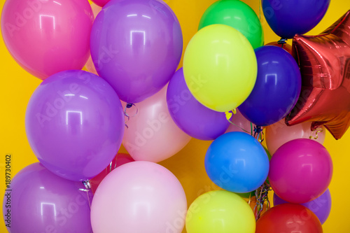 balloons of different colors with gifts for the holiday