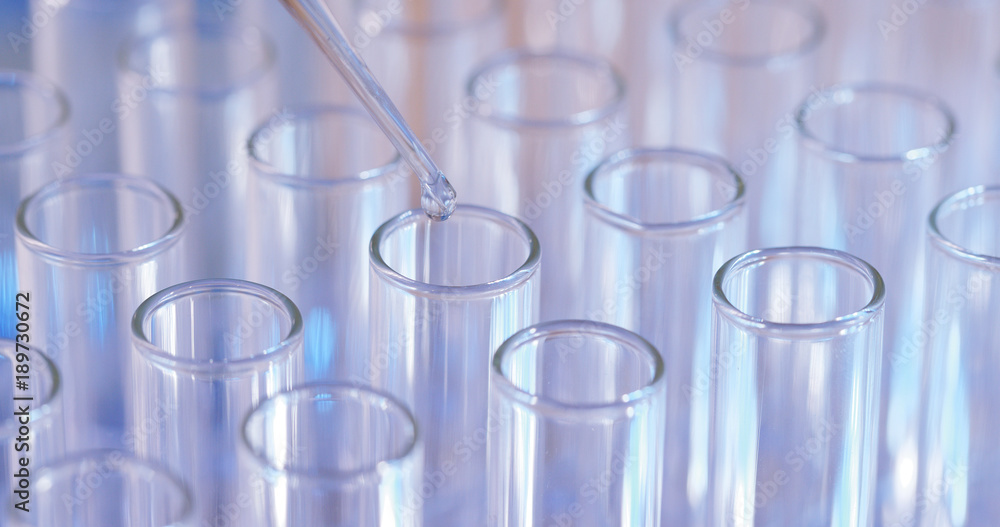Test Tubes being filled Test Tubes being filled