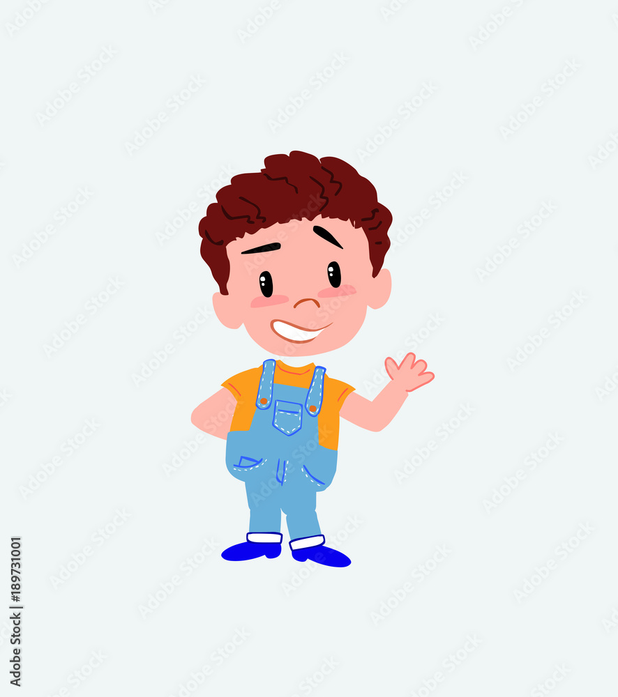 White boy in jeans showing something in positive attitude. White boy in jeans showing something in positive attitude.