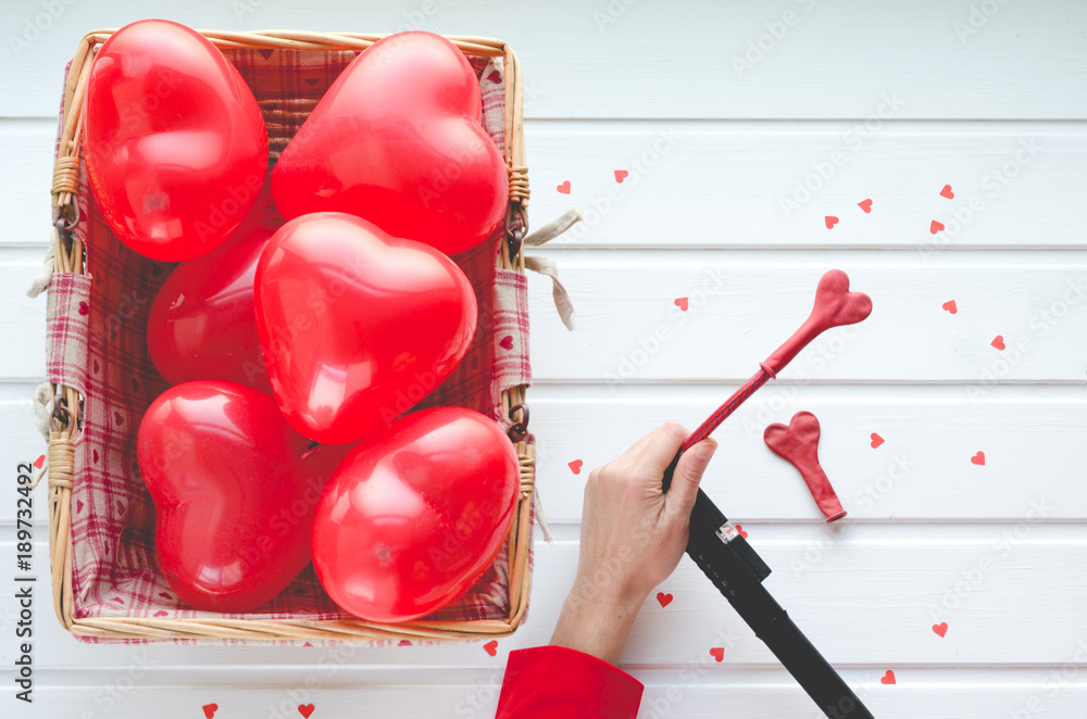 Valentine's Day, red hearts balloons on white wooden background, with space to write. Top view. Valentine's Day, red hearts balloons on white wooden background, with space to write. Top view.