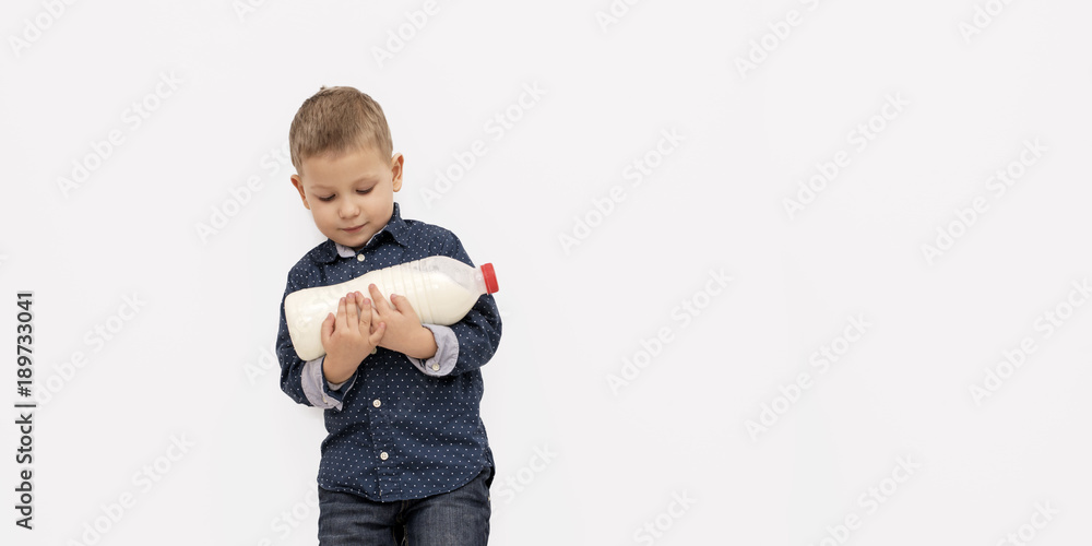 Smiling child boy drinking milk Smiling child boy drinking milk