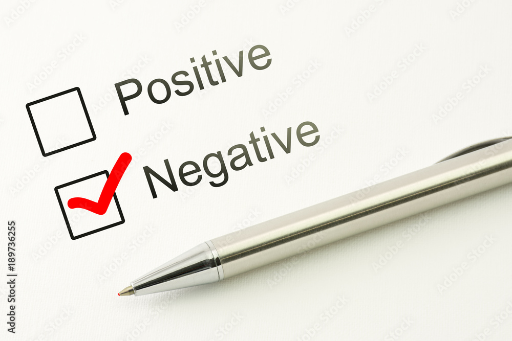 questionnaire: negative choice or positive, marked checkbox with a pen on paper background. Disapproval concept questionnaire: negative choice or positive, marked checkbox with a pen on paper background. Disapproval concept
