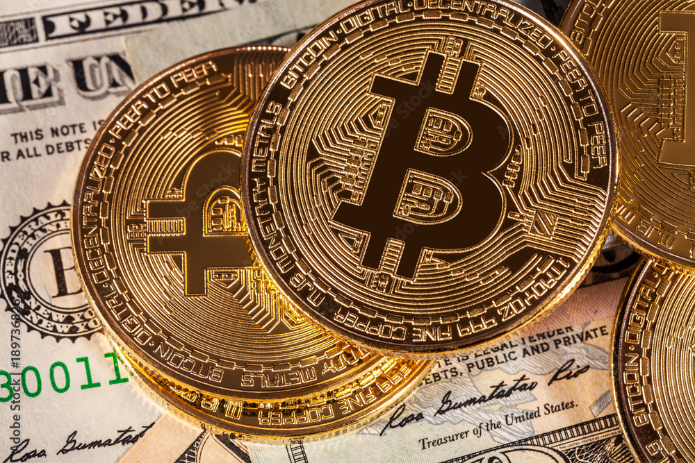 golden bitcoin on money bills background