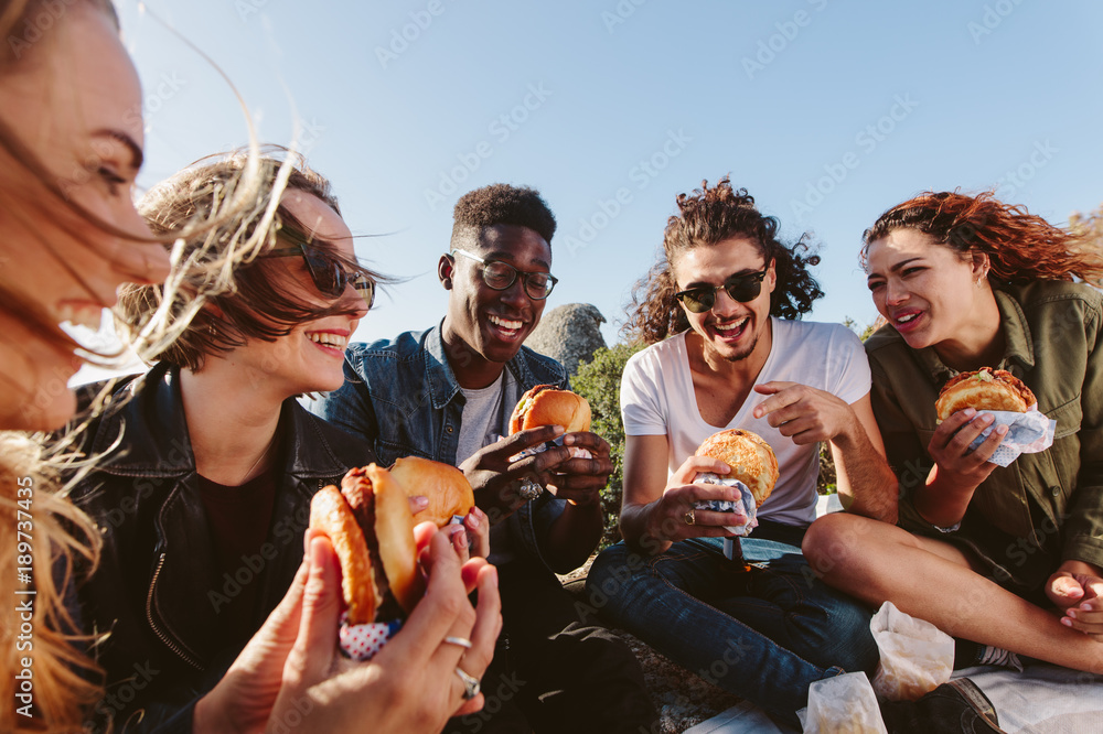 Naklejka premium Young people having a picnic on mountain top