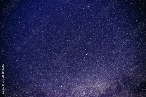 Background of starry purple night sky with the Milky Way