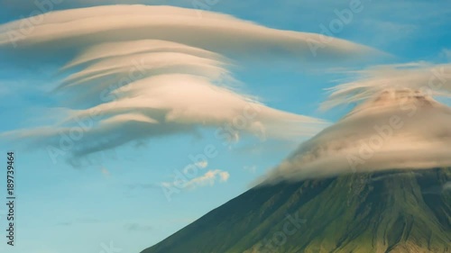 Mayon Volcano with the ventricular of clouds. TimeLapse in sunrise. Active stratovolcano in the province of Albay in Bicol Region, on the island of Luzon in the Philippines. photo