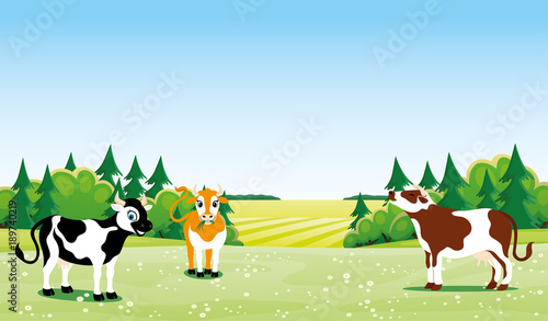 Cute cow on a green meadow with flowers.