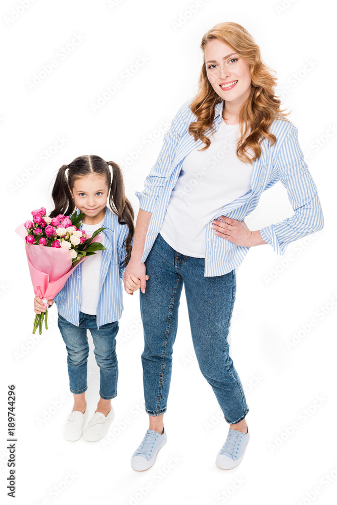 happy mother and little daughter with bouquet of flowers holding hands isolated on white, mothers day holiday concept happy mother and little daughter with bouquet of flowers holding hands isolated on white, mothers day holiday concept