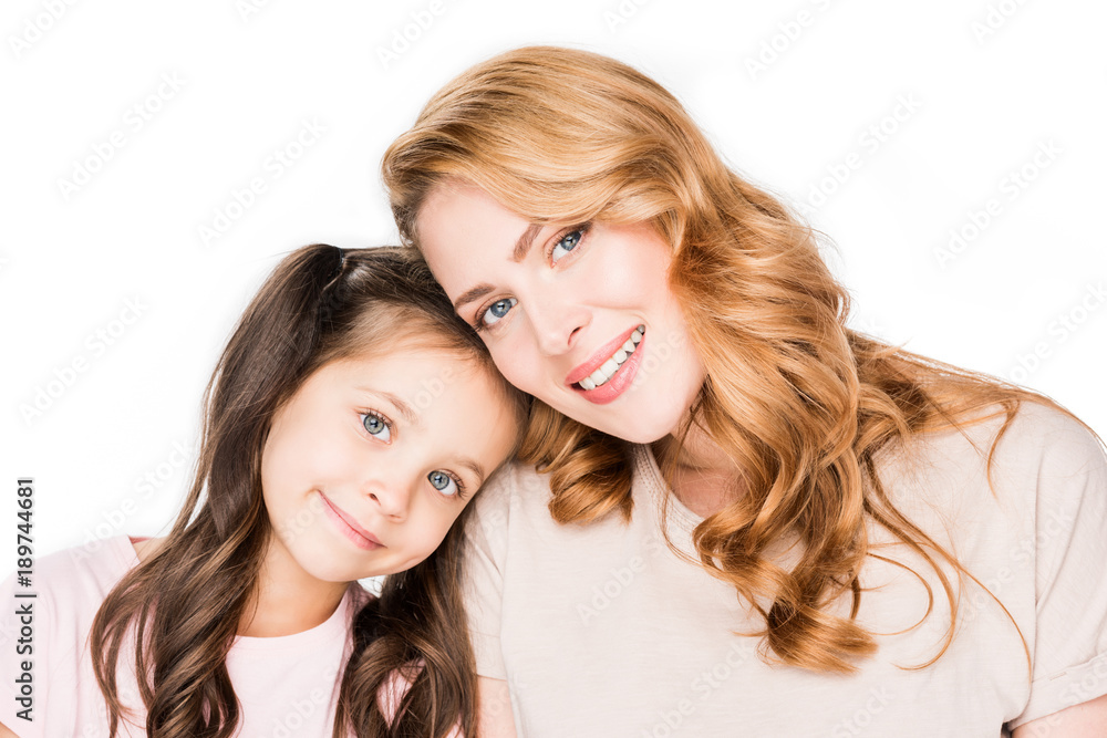 portrait of smiling mother and daughter isolated on white portrait of smiling mother and daughter isolated on white
