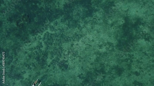 Birds eye view of fisherman on pirogue boat on sea