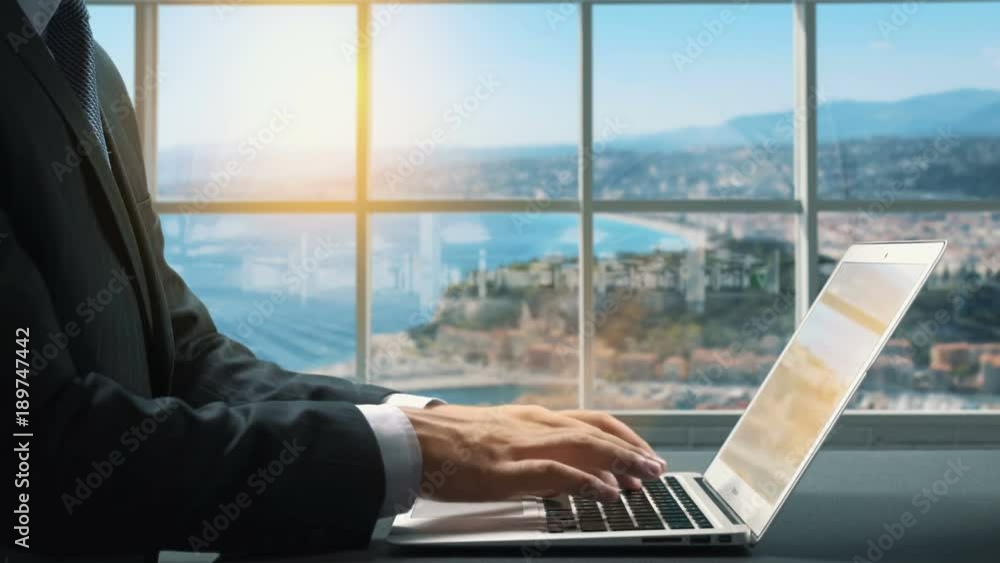 View of Nice France.Close up hand Businessman using laptop View of Nice France.Close up hand Businessman using laptop