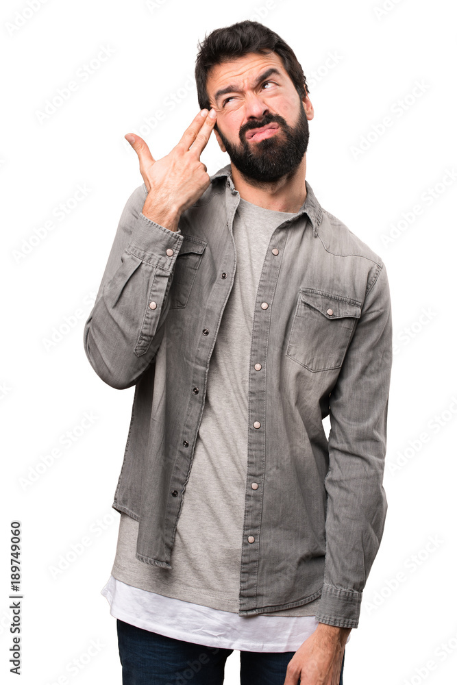 Handsome man with beard making suicide gesture on white background Handsome man with beard making suicide gesture on white background