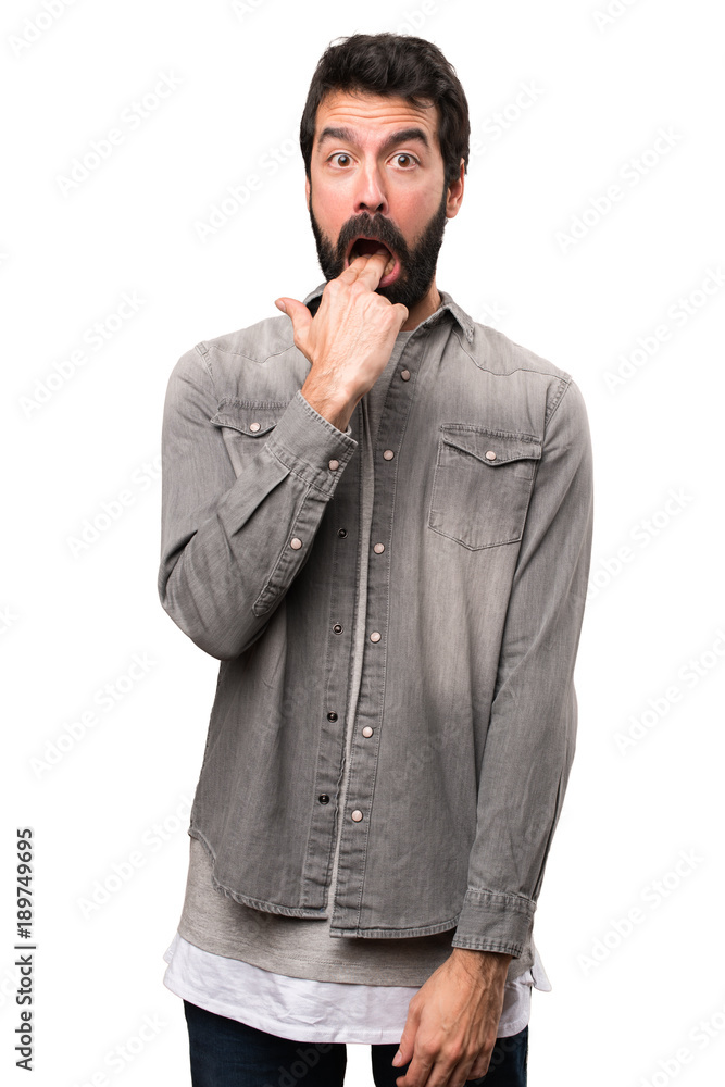 Handsome man with beard making vomiting gesture on white background Handsome man with beard making vomiting gesture on white background