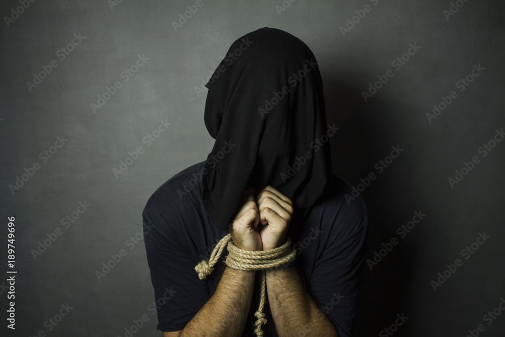 Man with tied hands and black bag on his head Stock Photo Adobe