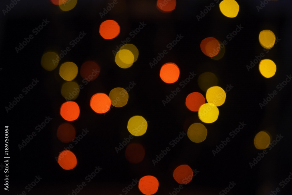 Obraz premium colorful blured bokeh growing in the dark