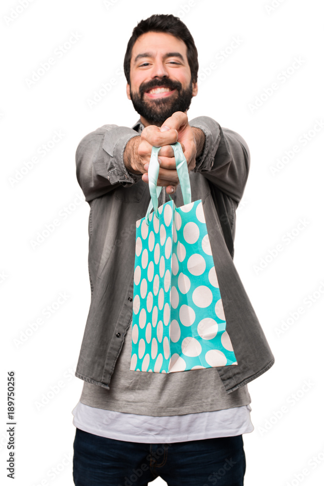 Handsome man with beard with shopping bag on white background Handsome man with beard with shopping bag on white background