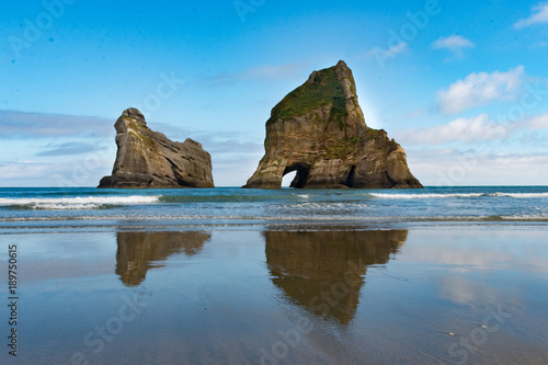 New Zealand wharariki beach and arch island rock formations