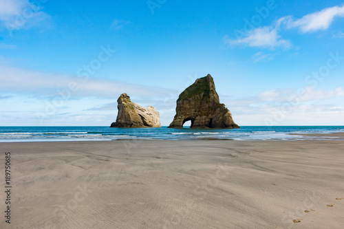 New Zealand wharariki beach and arch island rock formations © Bjoern