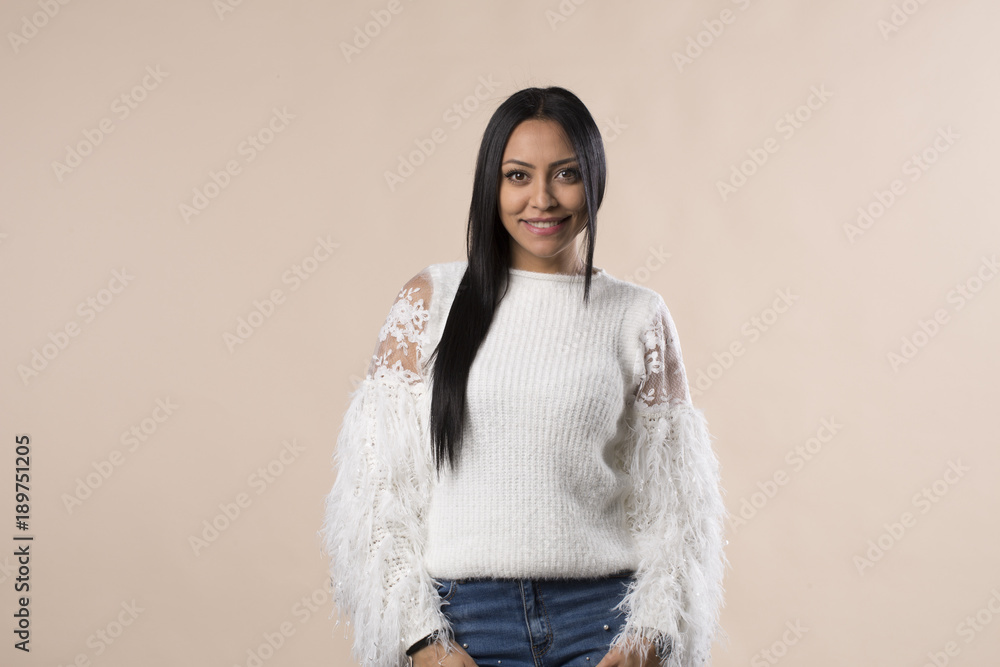 Young latina arabic woman with long dark hair on studio background Young latina arabic woman with long dark hair on studio background