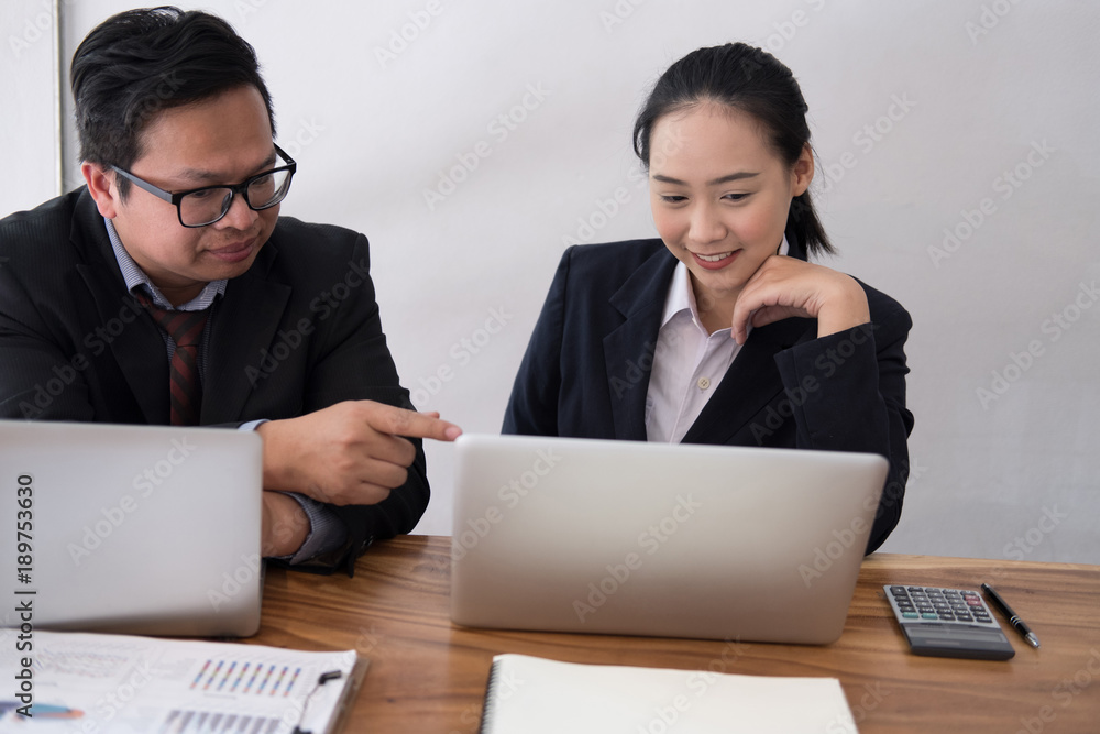 business adviser analyzing company financial report. professional investor discussing balance sheet data. businessman & businesswoman working on startup project with co working team. business adviser analyzing company financial report. professional investor discussing balance sheet data. businessman & businesswoman working on startup project with co working team.