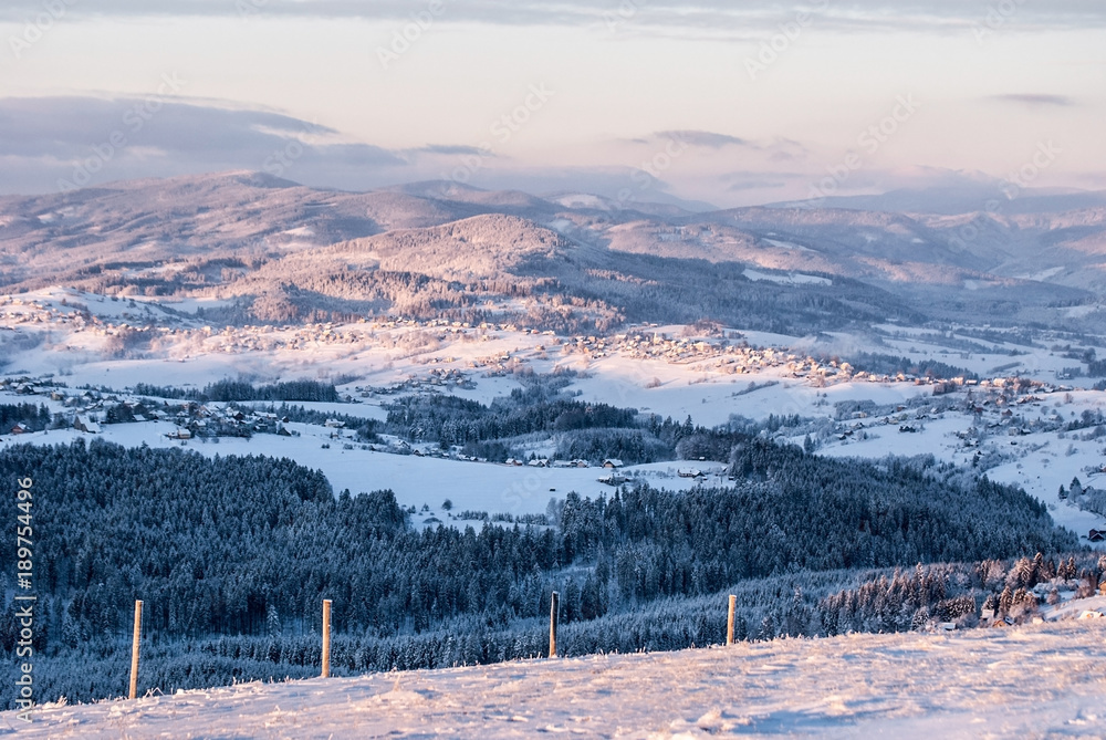 view from Ochodzita hill above Koniakow village in Silesian Beskids mountains in Poland during freezing winter morning