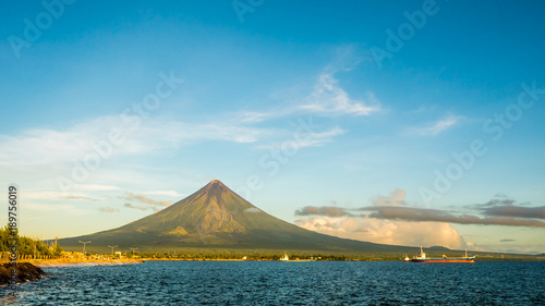 Mayon Volcano is an active stratovolcano in the province of Albay in Bicol Region, on the island of Luzon in the Philippines. Renowned as the perfect cone because of its symmetric conical shape. photo