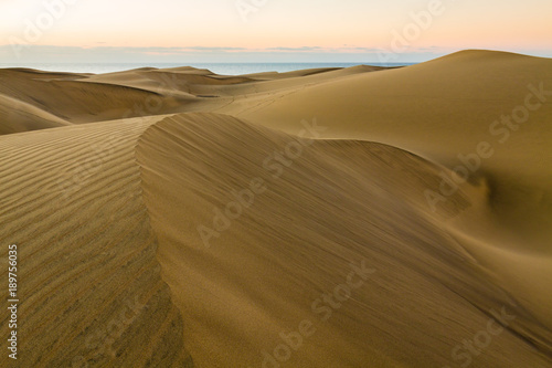 Landscape of empty sand desert. Dunes of Maspalomas, Gran Canaria island.