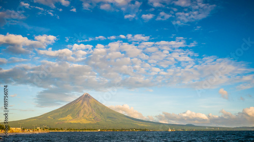 Mayon Volcano is an active stratovolcano in the province of Albay in Bicol Region, on the island of Luzon in the Philippines. Renowned as the perfect cone because of its symmetric conical shape. photo