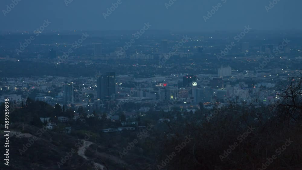 View of Hollywood main strip at dusk from Hollywood Hills and Griffith Park on a hazy, smoggy, foggy evening View of Hollywood main strip at dusk from Hollywood Hills and Griffith Park on a hazy, smoggy, foggy evening