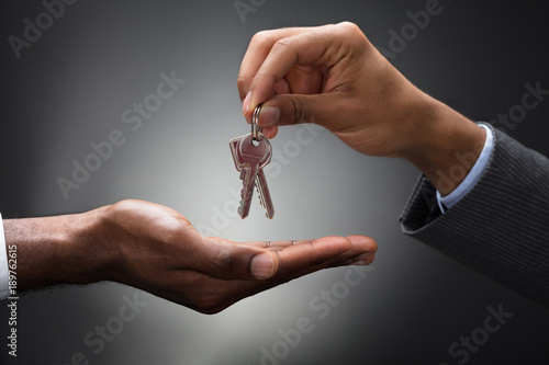 фотографія Hand Passing Keys To New Owner
