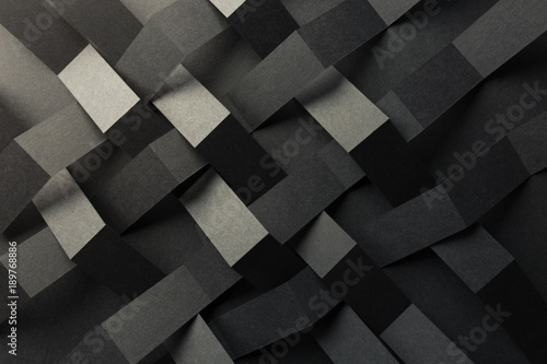 Abstract pattern made of black paper, dark background	