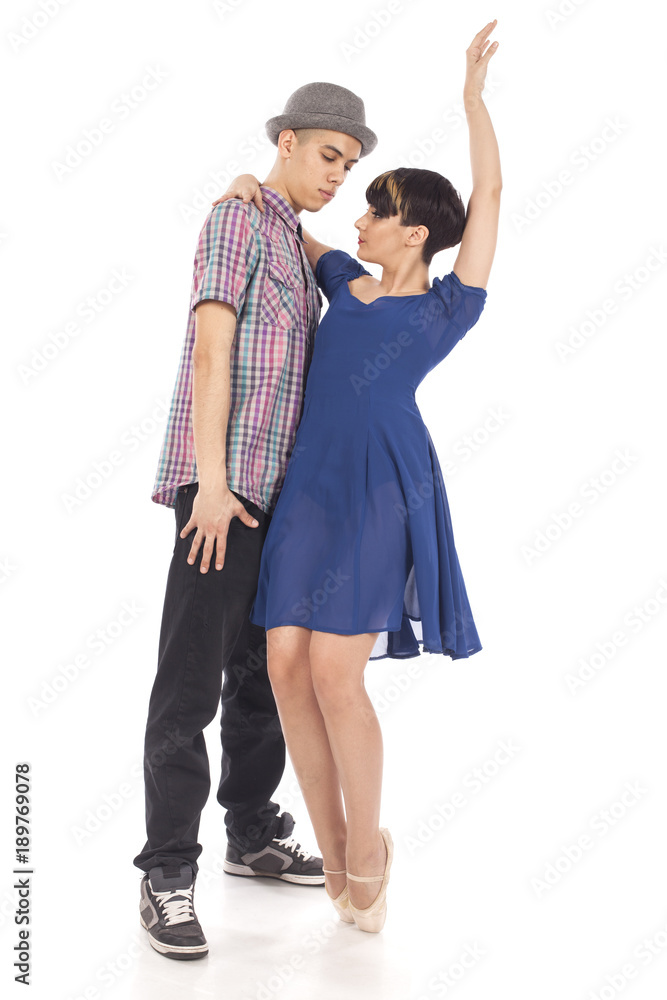 Couple of two dancers, woman on pointes, man with hat holding close in dynamic dance figure, on white background Couple of two dancers, woman on pointes, man with hat holding close in dynamic dance figure, on white background
