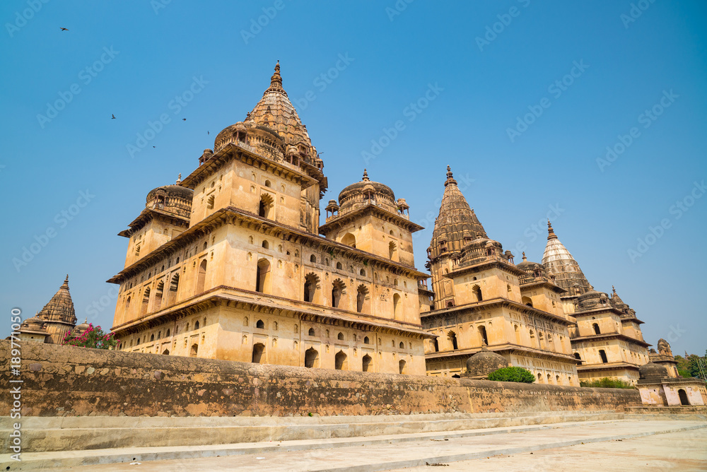 Orchha Cenotaphs, sunny day vleear blue sky, Moghul gardens. Also spelled Orcha, famous travel destination in India.
