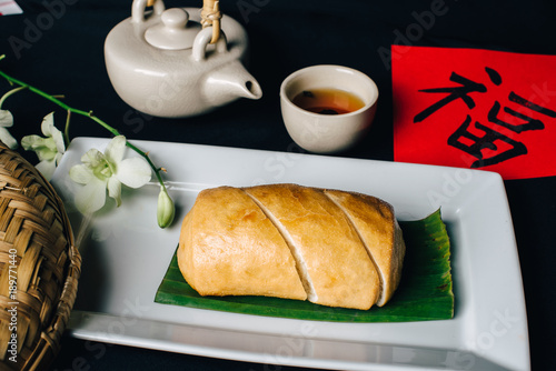 Concept picture for Chinese new year table set up and Chinese deish, bun with Chinese word means fortune photo