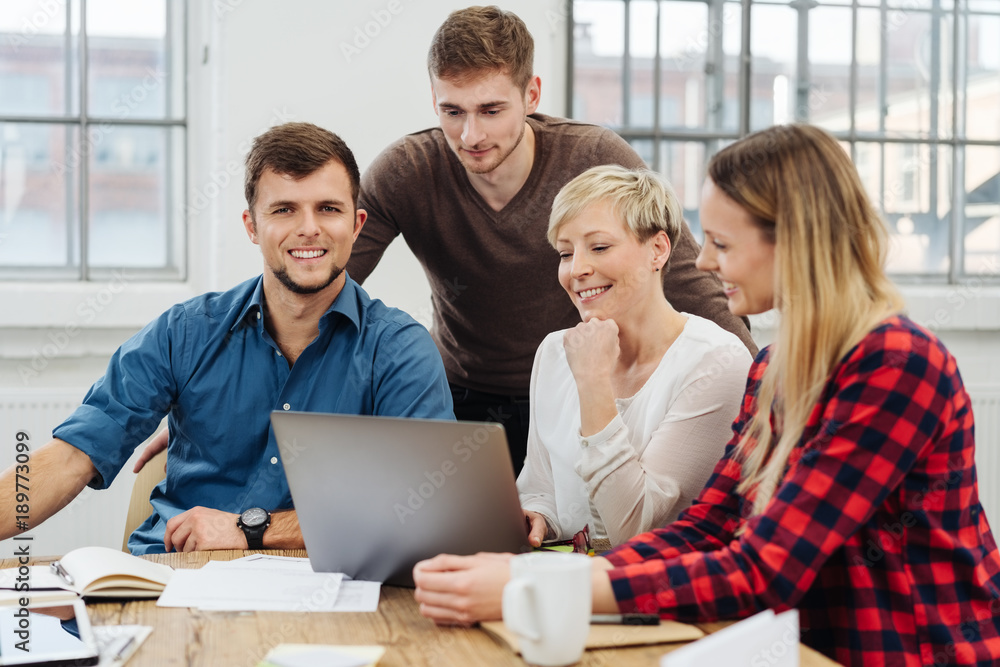 Enthusiastic young business team in a meeting Enthusiastic young business team in a meeting