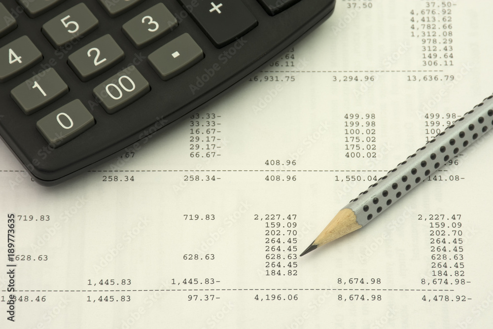 Accounting concept. Pencil and calculator on a numbers background Accounting concept. Pencil and calculator on a numbers background