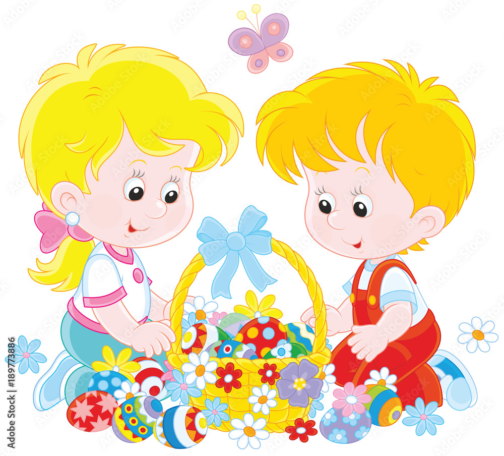 Little children with a decorated Easter basket of colorfully painted eggs and flowers Little children with a decorated Easter basket of colorfully painted eggs and flowers