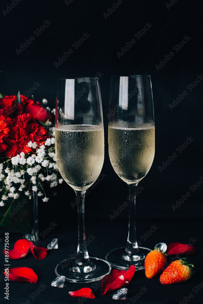 Concept picture for Valentine's day. 2 glasses of Champaign with rose petal, strawbery and flower Concept picture for Valentine's day. 2 glasses of Champaign with rose petal, strawbery and flower