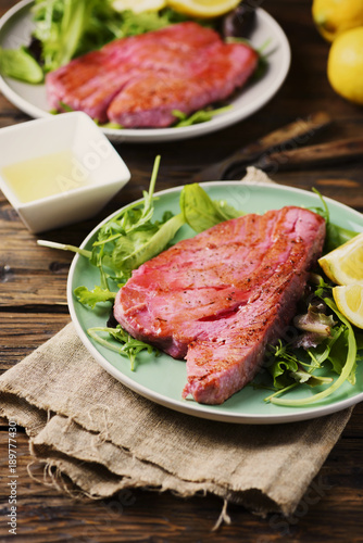 Cooked delicious tuna fish with green salad