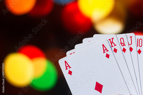 Royal flush poker cards combination on blurred background casino luck fortune card game