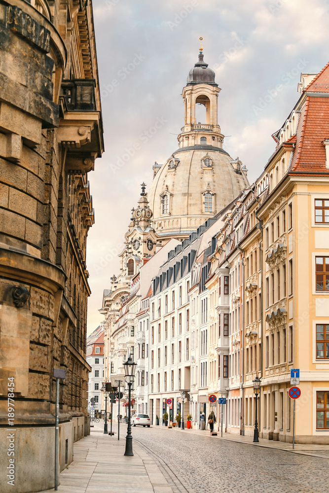 Naklejka premium A narrow street in the historic center of Dresden in the morning without pedestrians and cars