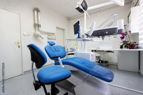 Dental ordination with blue dental chair photo